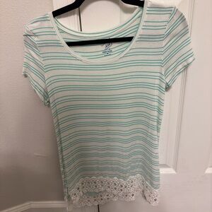 White and green striped, medium shirt with lace bottom.